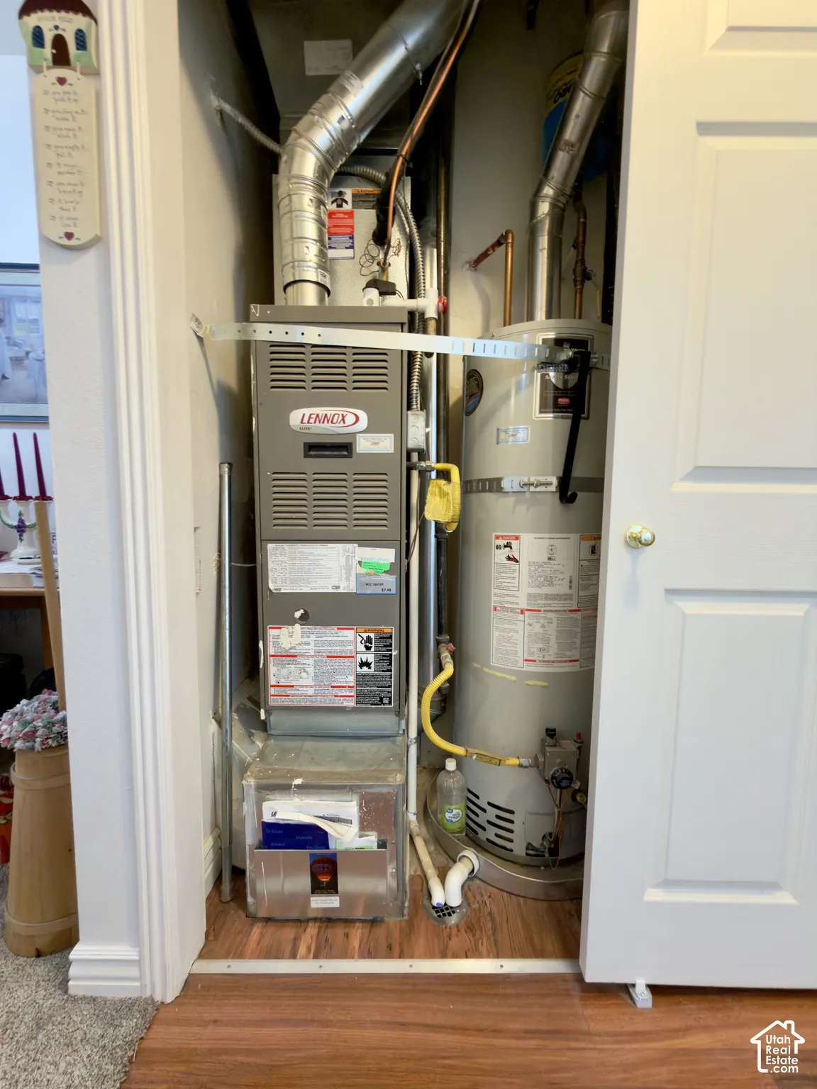 Utility closet with a Lennox furnace and water heater