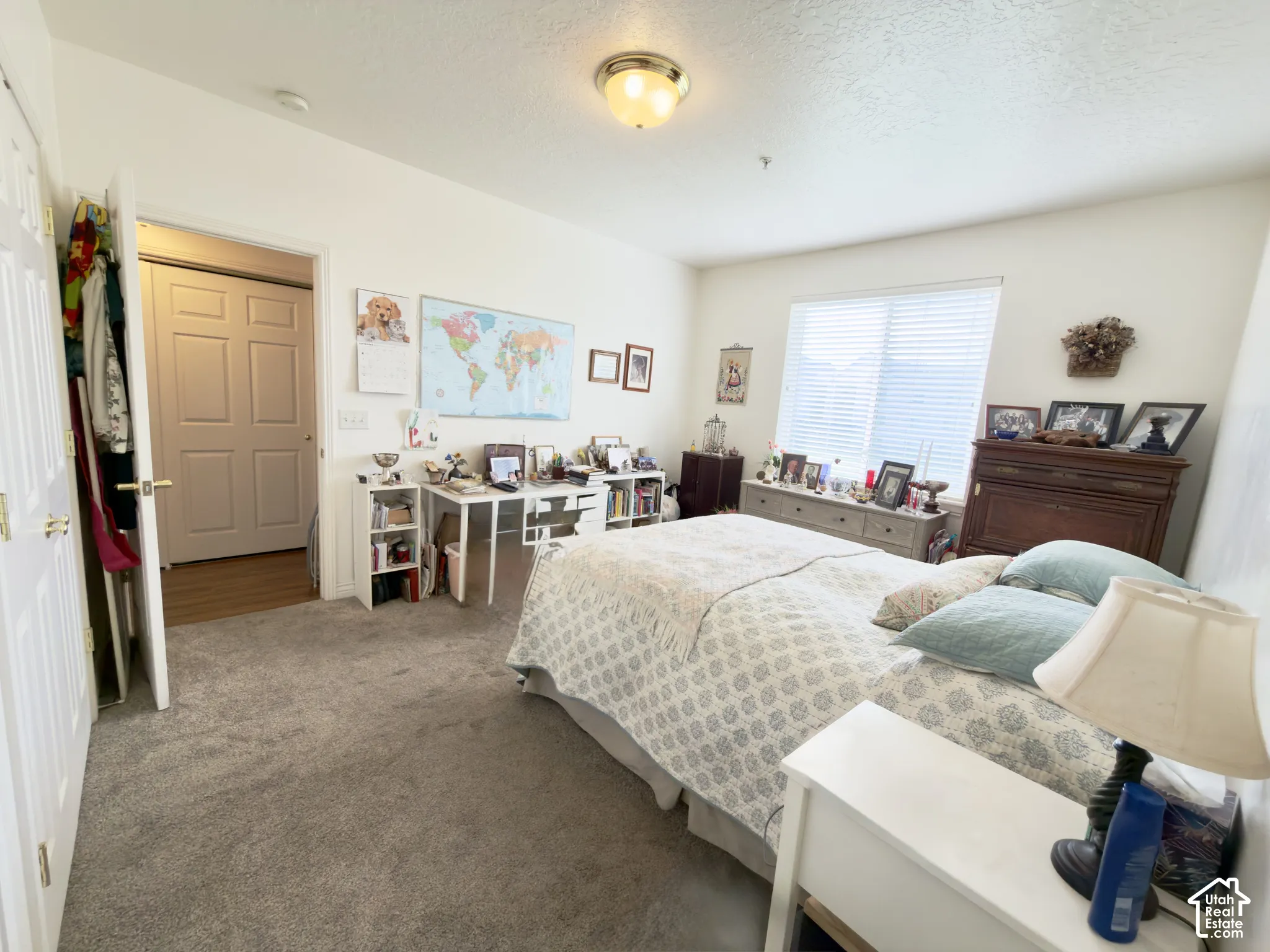 Large bedroom with a large window & double closets