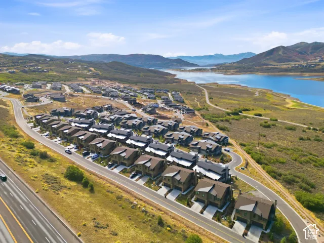 Residential development featuring multiple properties with two-car garages and paved driveways