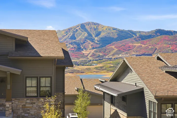 Houses with composite shingle roofs and stone accents