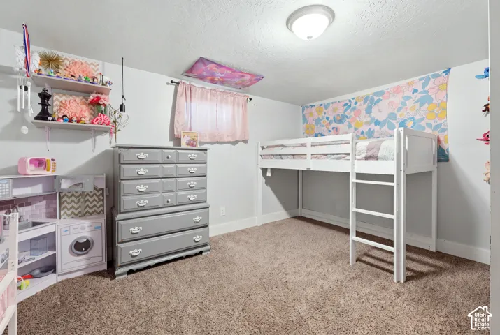 Wall-to-wall carpeting and white baseboards