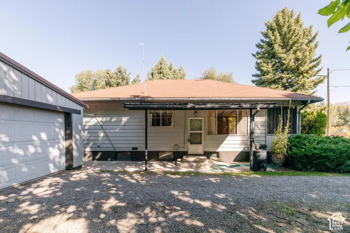 Attached garage with a white panel door