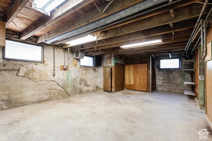 Concrete flooring with exposed ceiling joists and ductwork