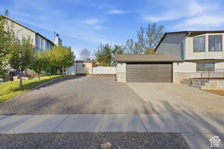 Attached two-car garage with a paved driveway