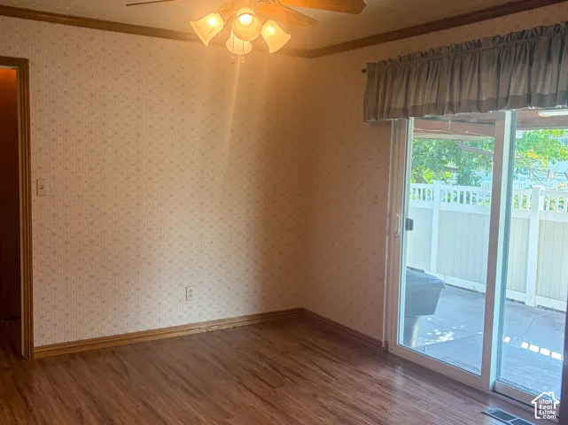 Formal dining room with sliding glass door access to covered back porch and yard