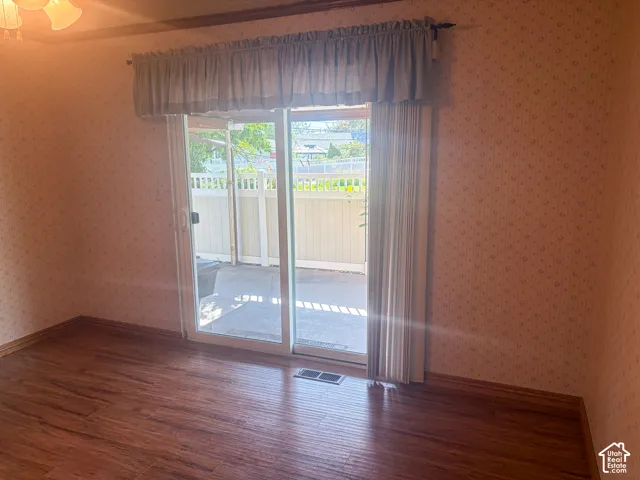 Formal dining room with sliding glass door leading to an outdoor patio area