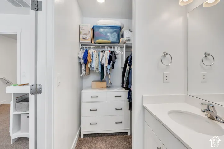 Integrated vanity with an undermount sink and chrome faucet