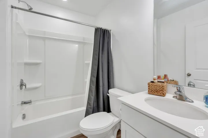 White vanity with an integrated sink and chrome faucet