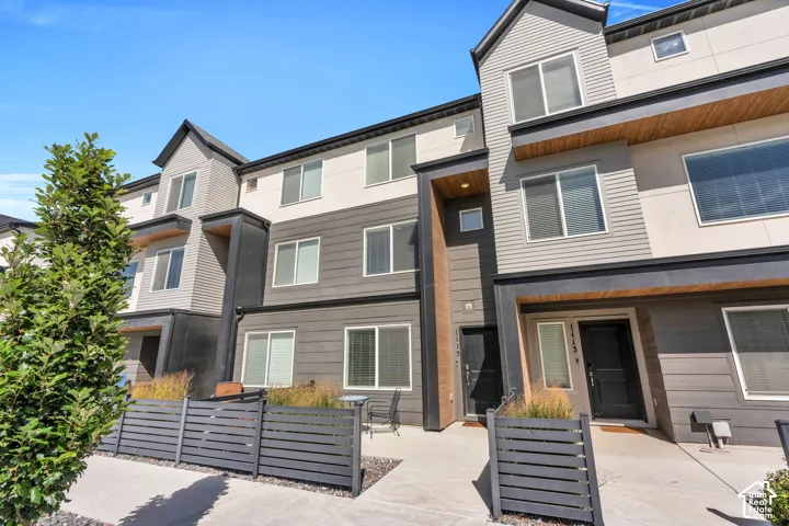 Contemporary multi-level facade featuring varied siding textures