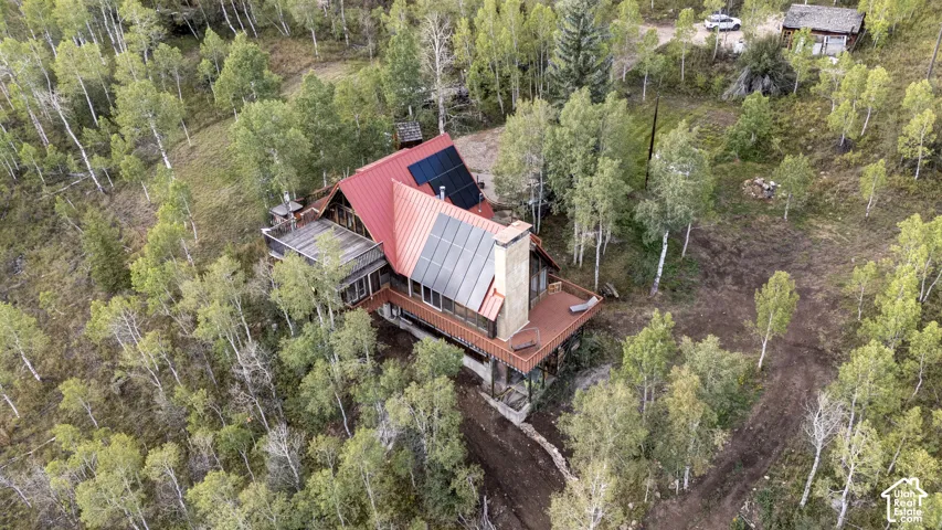 Red metal roof with solar panels