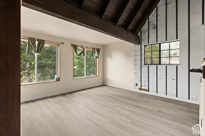 Vaulted wood-plank ceiling with exposed beams