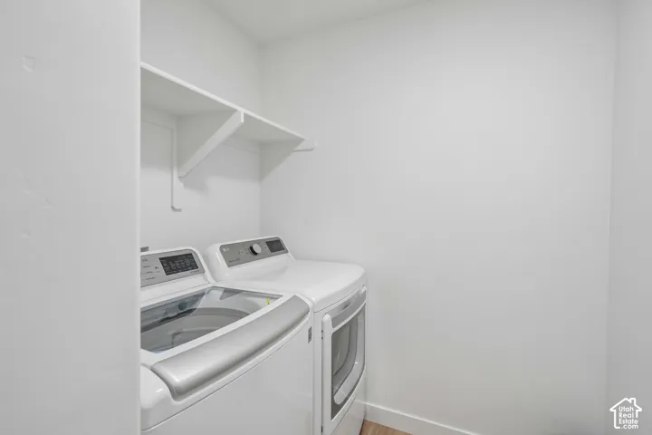 Utility area featuring white walls and built-in shelving