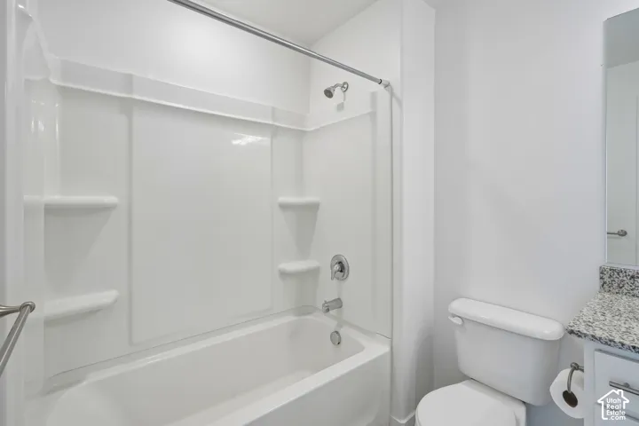 Bathtub with integrated shelving, chrome fixtures, and a shower rod