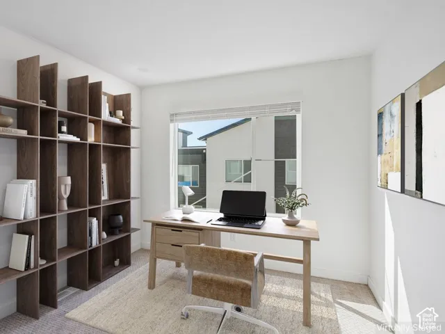 Recessed lighting, wood-finish built-in shelving, a single window, and light-colored carpeting
