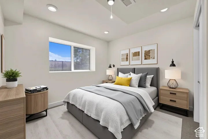 Recessed lighting, wood-finish flooring, a contemporary window, and built-in wall sconces