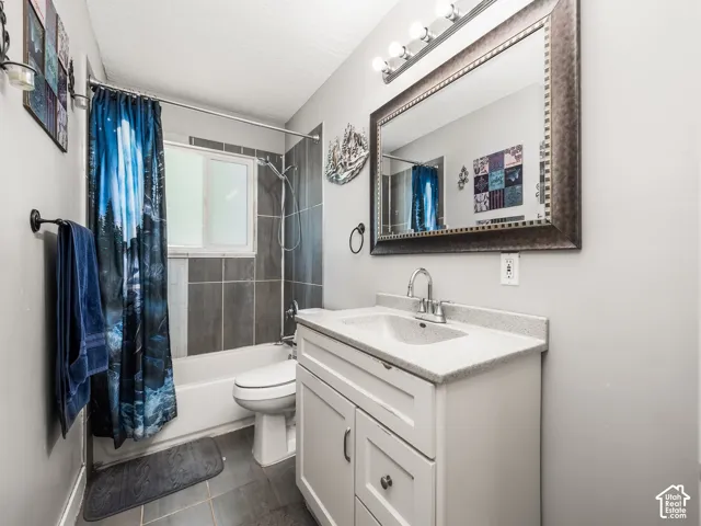 White vanity with an integrated sink and chrome faucet
