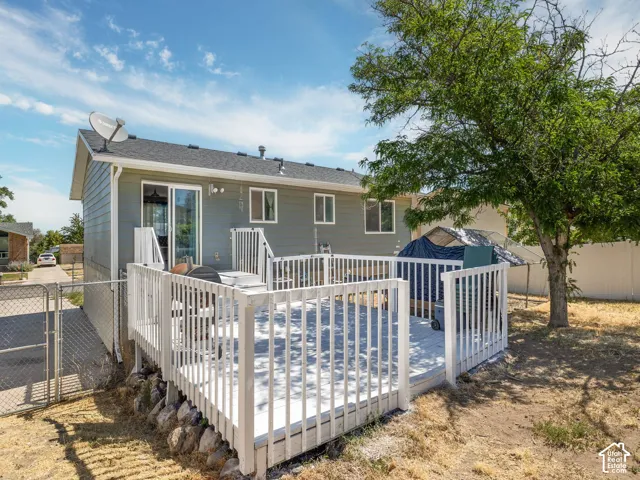 Spacious rear deck featuring white railings
