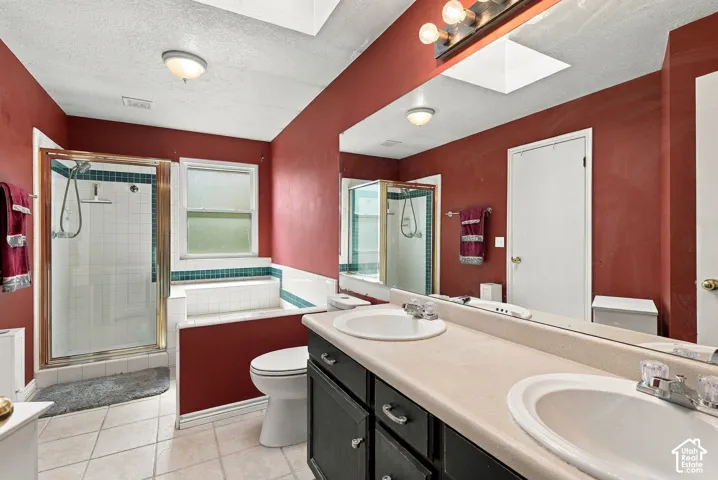 Dual vanity with integrated sinks, a built-in shower, and a soaking tub