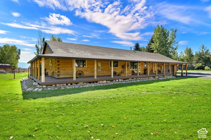 Exterior view from the lot of the wood cabin home