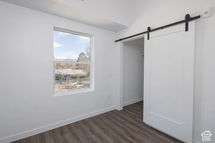 Wood-finish flooring with white walls and trim