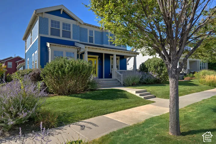Two-story residence with blue siding and shake accents