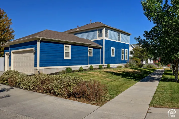 Two-story residence with blue horizontal siding and light blue shake siding