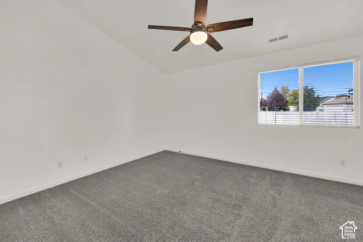 Primary Bedroom with vaulted ceiling with a contemporary ceiling fan and light fixture