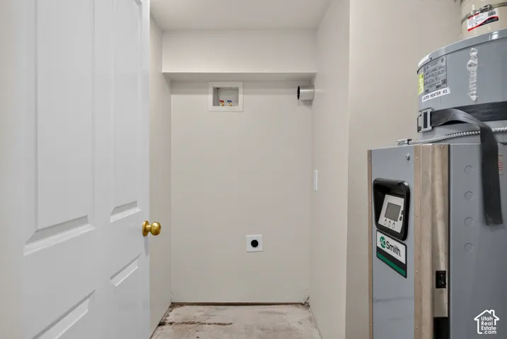 Utility area with a water heater and furnace