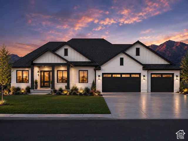 Contemporary farmhouse exterior featuring white brick and vertical siding accents