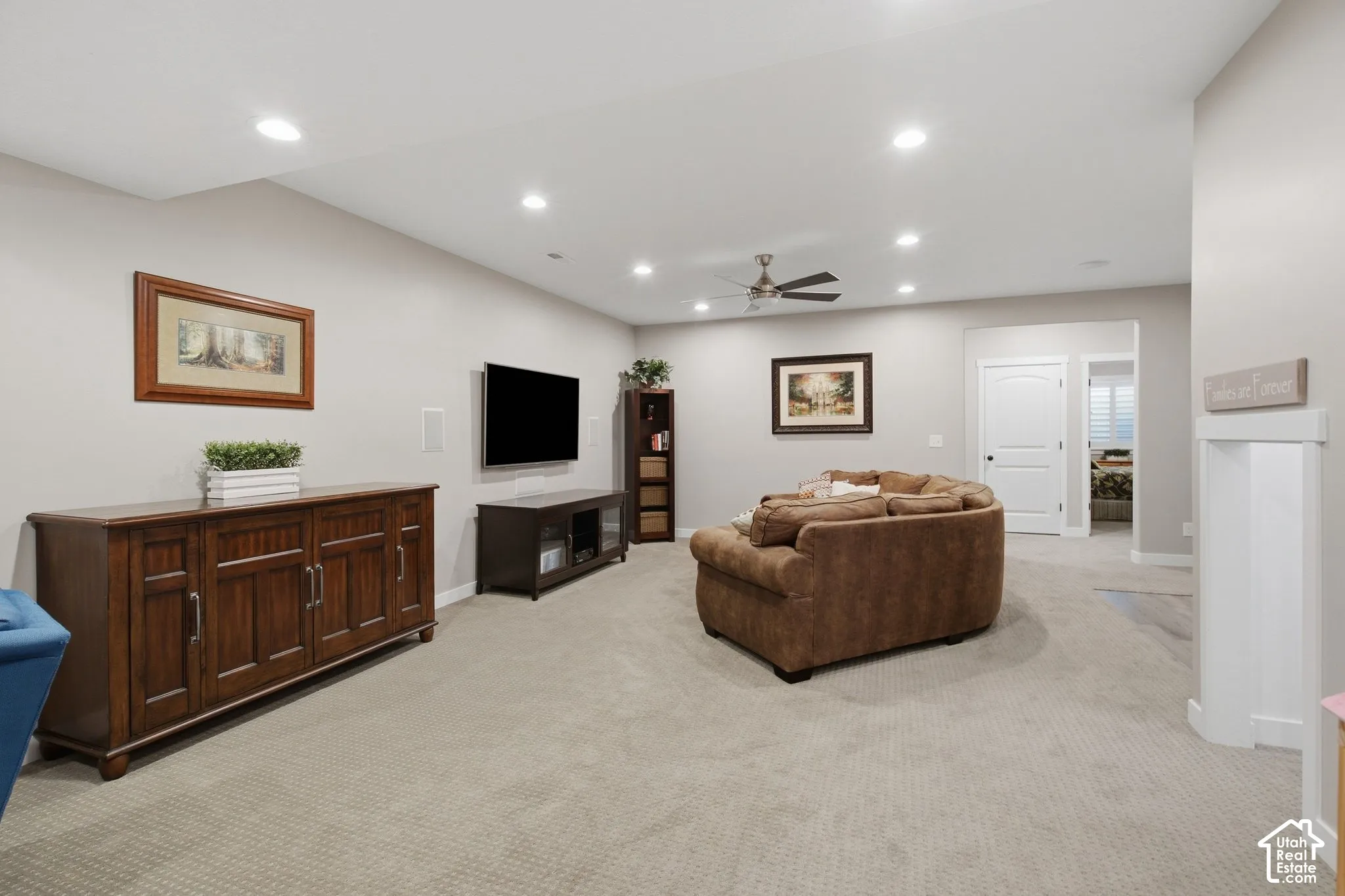 Recessed lighting, ceiling fan, and carpeted flooring