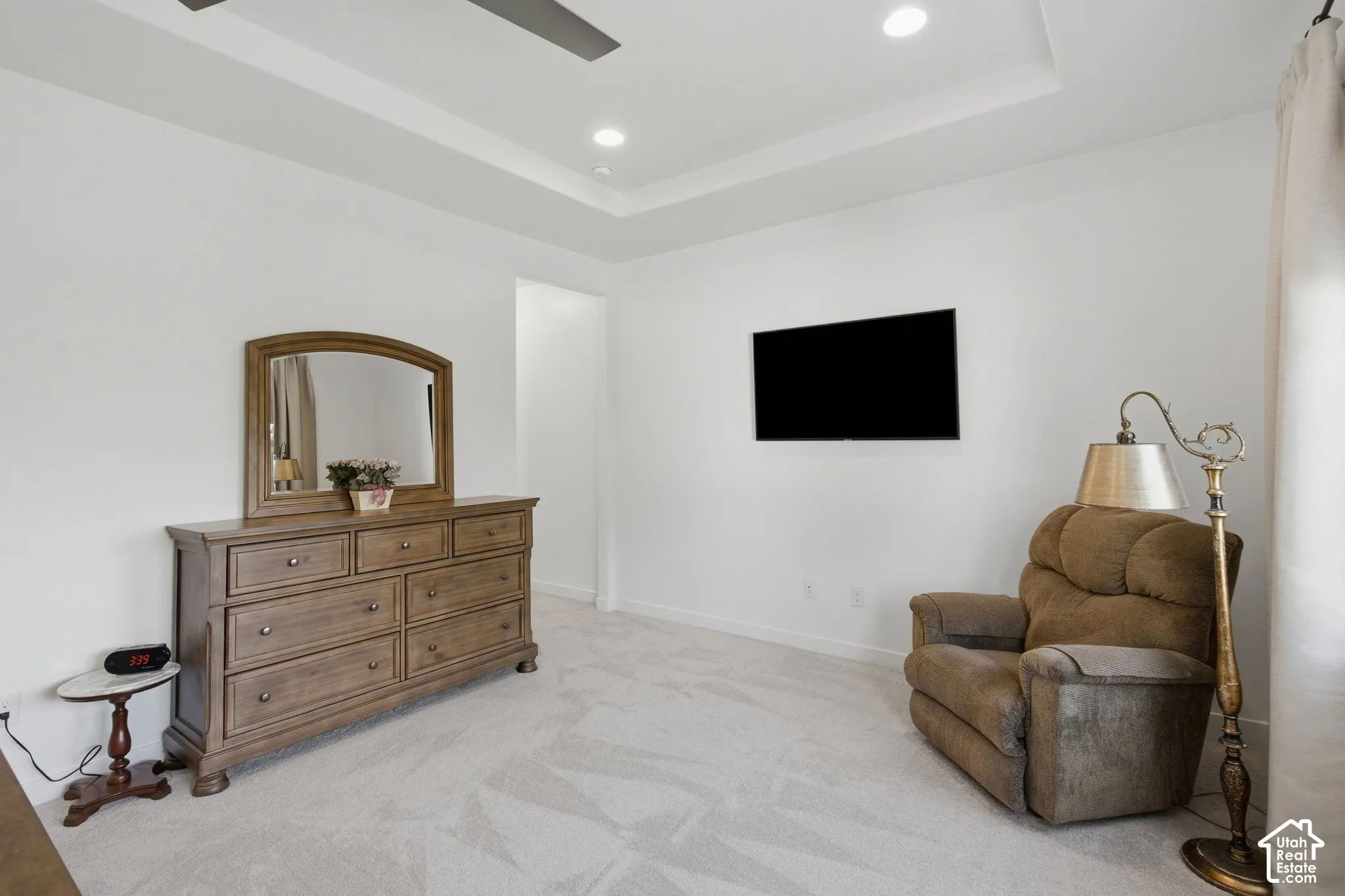 Tray ceiling with recessed lighting and a ceiling fan