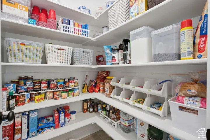 Extensive built-in shelving with L-shaped configuration
