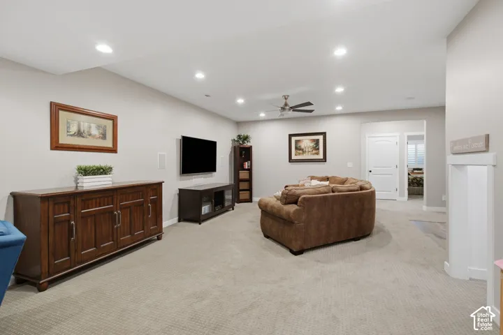 Recessed lighting, ceiling fan, and carpeted flooring