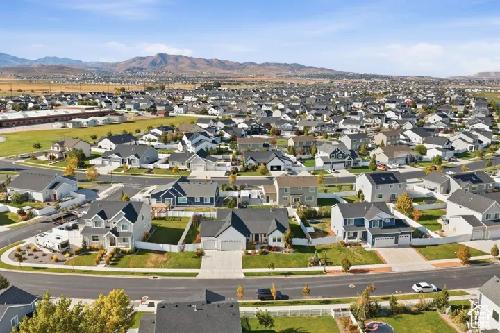 Expansive residential neighborhood with consistent architectural styles and mountain scenery