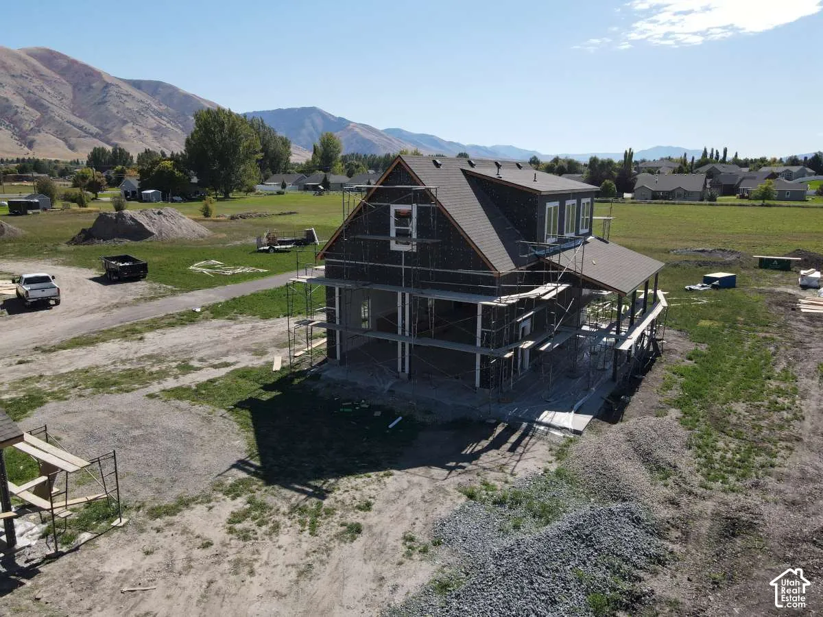 Newly constructed residence with a dark-toned roof and siding