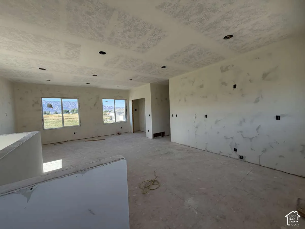Spacious interior featuring multiple windows, recessed lighting, and an open layout