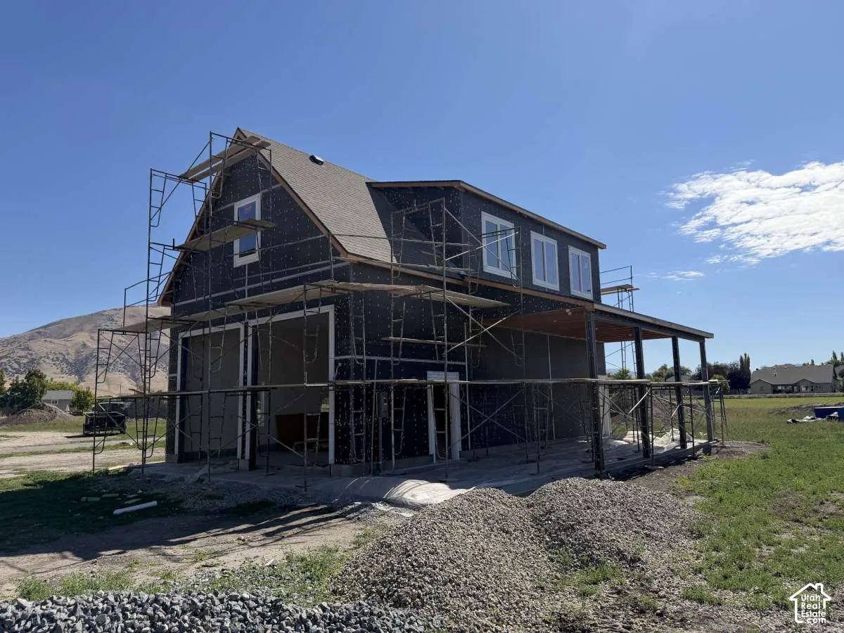 Two-story structure with a gabled roof and covered side patio