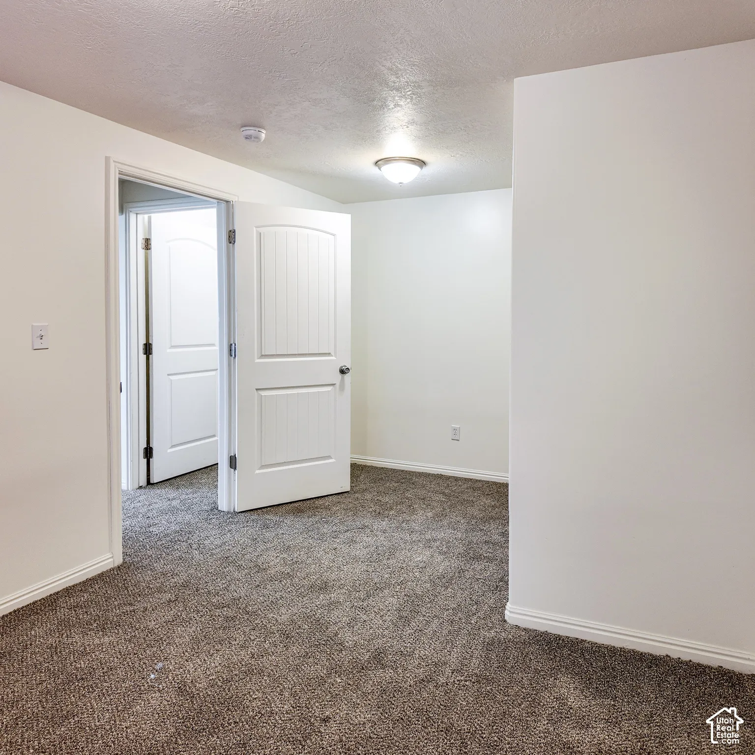 Neutral-toned carpeting throughout