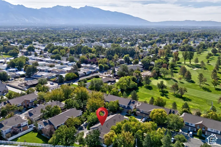 Mountain backdrop with expansive green spaces