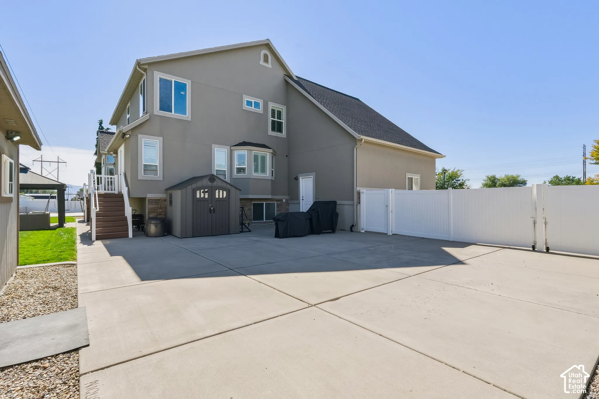 Expansive concrete driveway with clean geometric sections providing ample parking and vehicle space