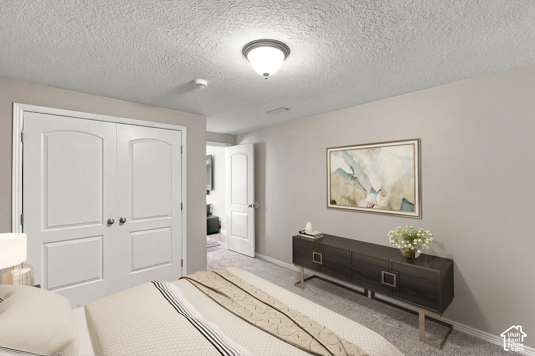 Wall-to-wall carpeting, recessed ceiling light fixture, white interior doors, and neutral wall tones