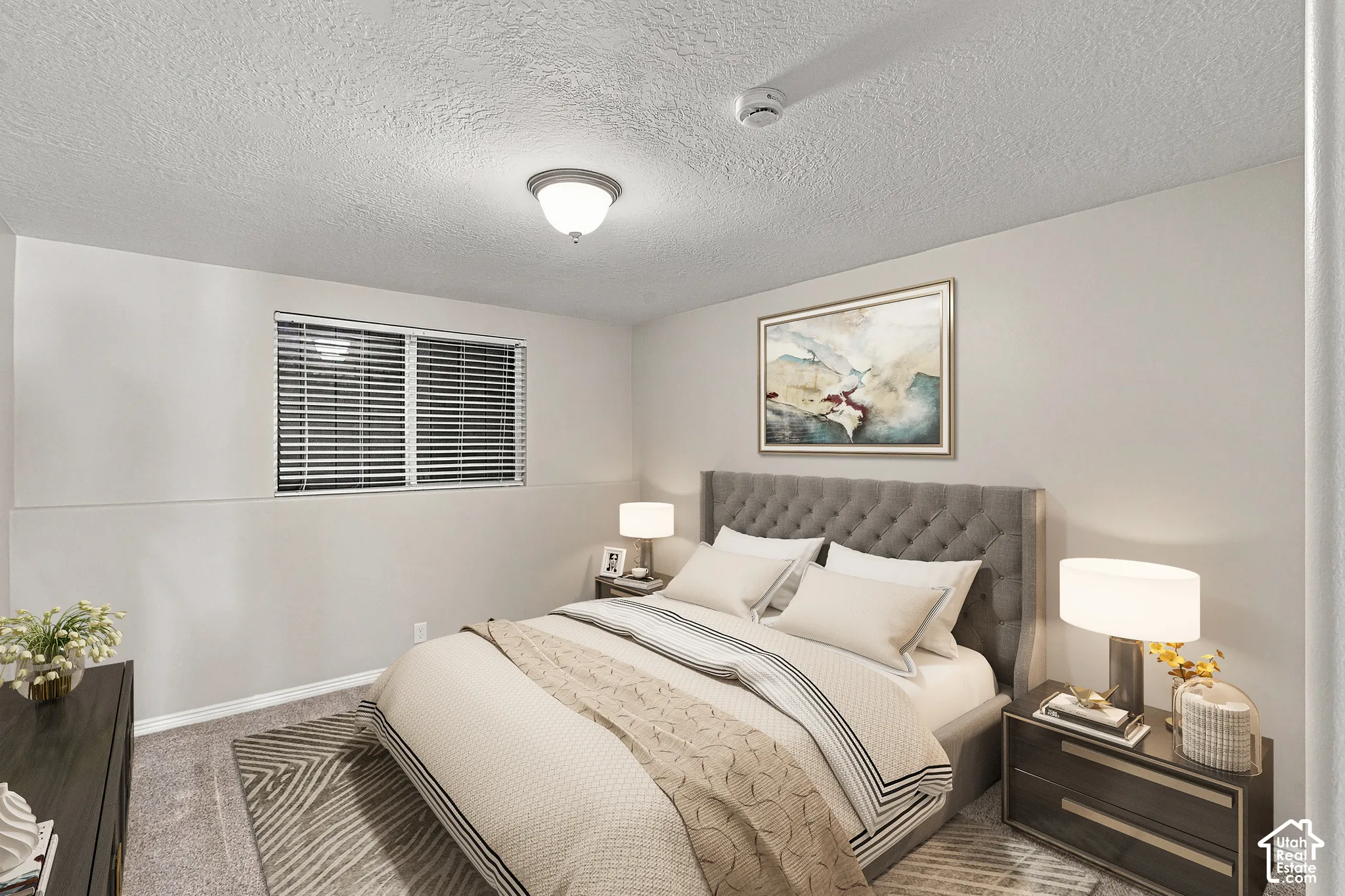 Window with blinds, wall-to-wall carpeting, overhead flush mount light fixture, textured ceiling, and neutral wall tones