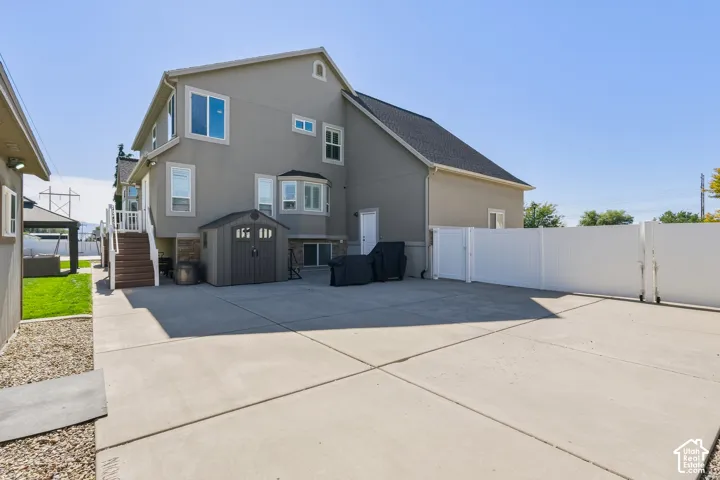 Expansive concrete driveway with clean geometric sections providing ample parking and vehicle space