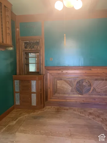 Built-in wood cabinetry with decorative glass panels