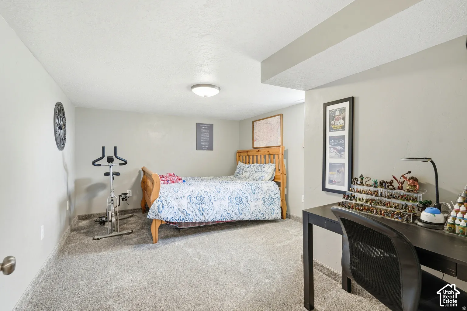Neutral wall tones, recessed ceiling beam, flush-mount ceiling light, and wall-to-wall carpeting