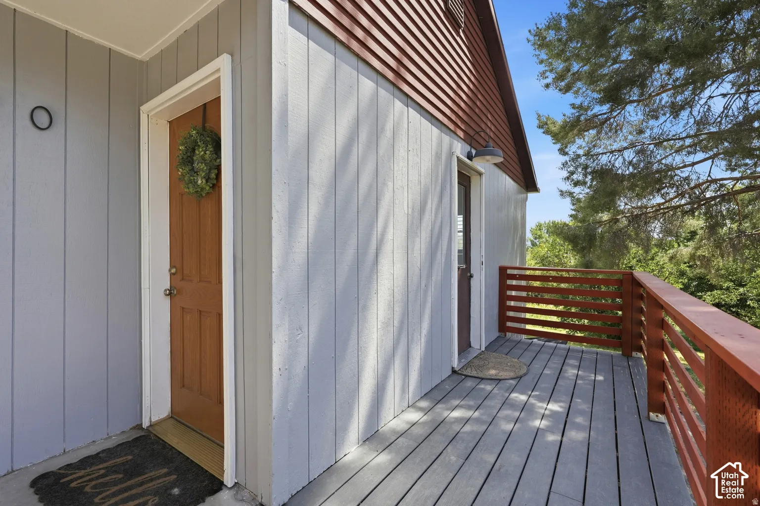 Exterior wood siding, wood-finish decking, and wood-finish railings