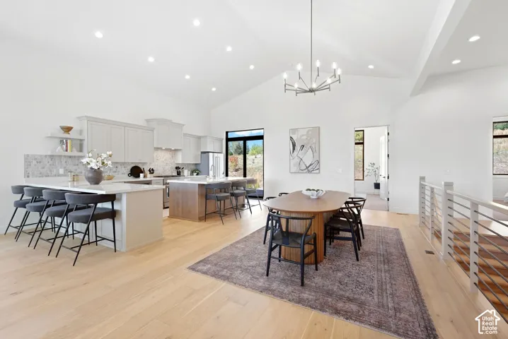 Vaulted ceilings complement the light wood-finish flooring