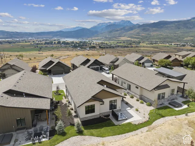 Modern residential community with mountain and lake backdrop