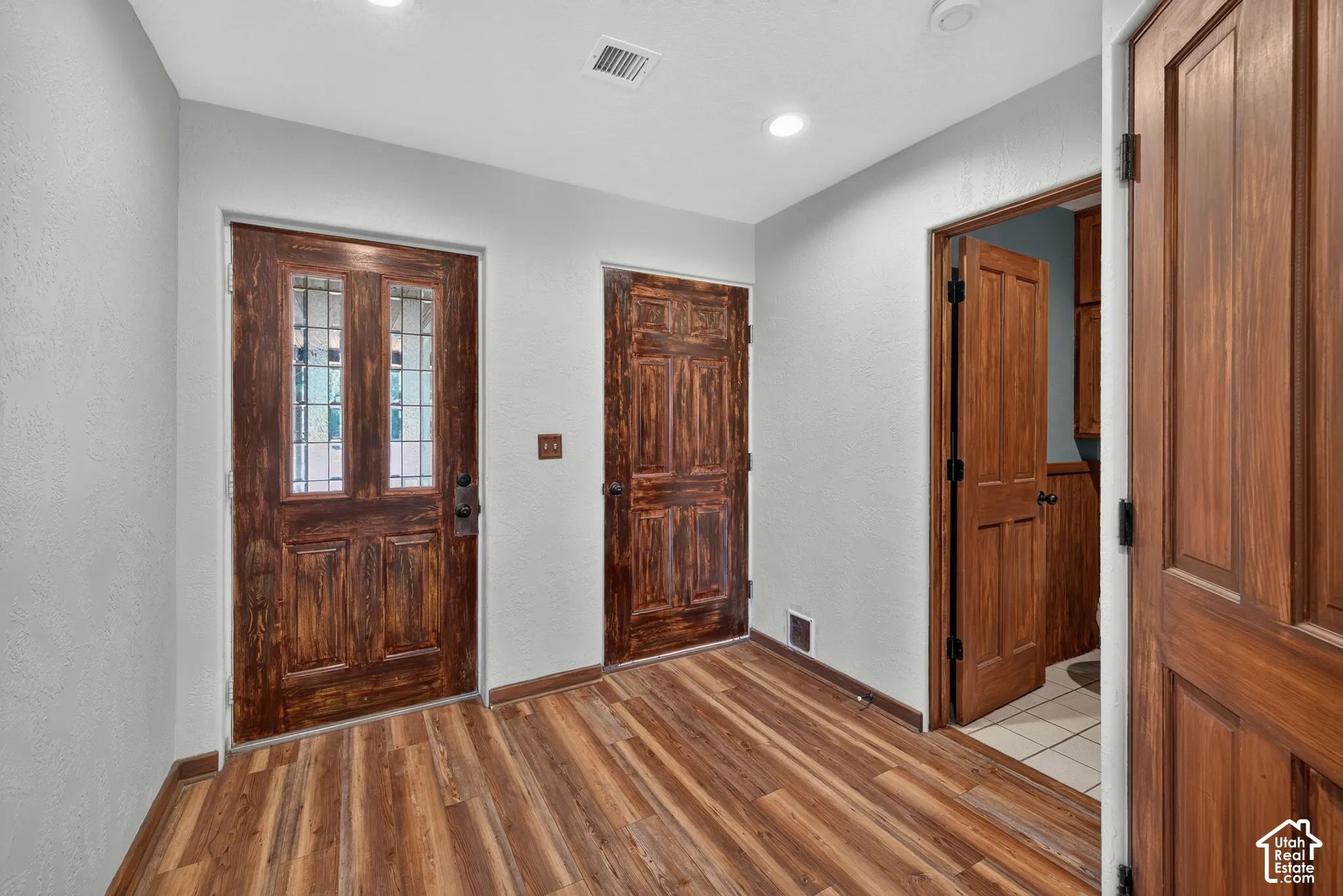 Foyer with Access to the Garage and Powder Room