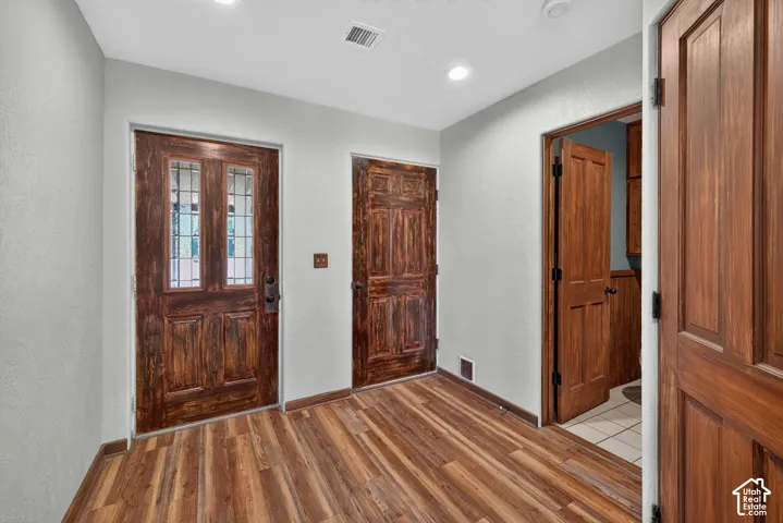 Foyer with Access to the Garage and Powder Room